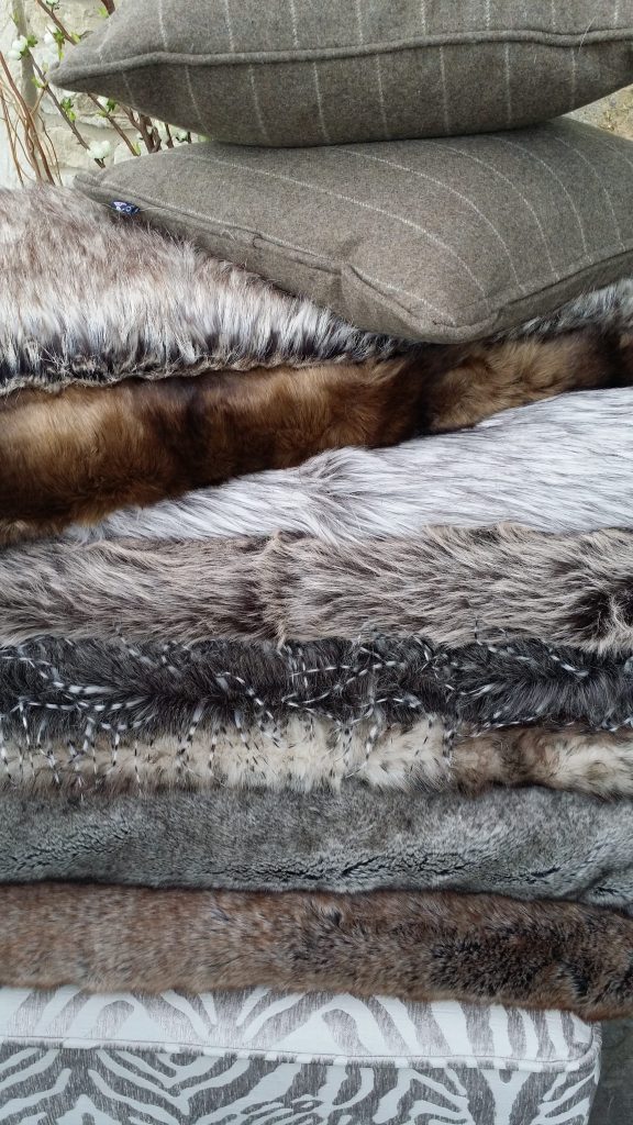 Hire luxury fake fur throws, cushions with vintage shabby chic furniture